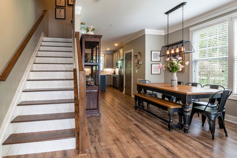 Bright and inviting dining area features a wooden table
